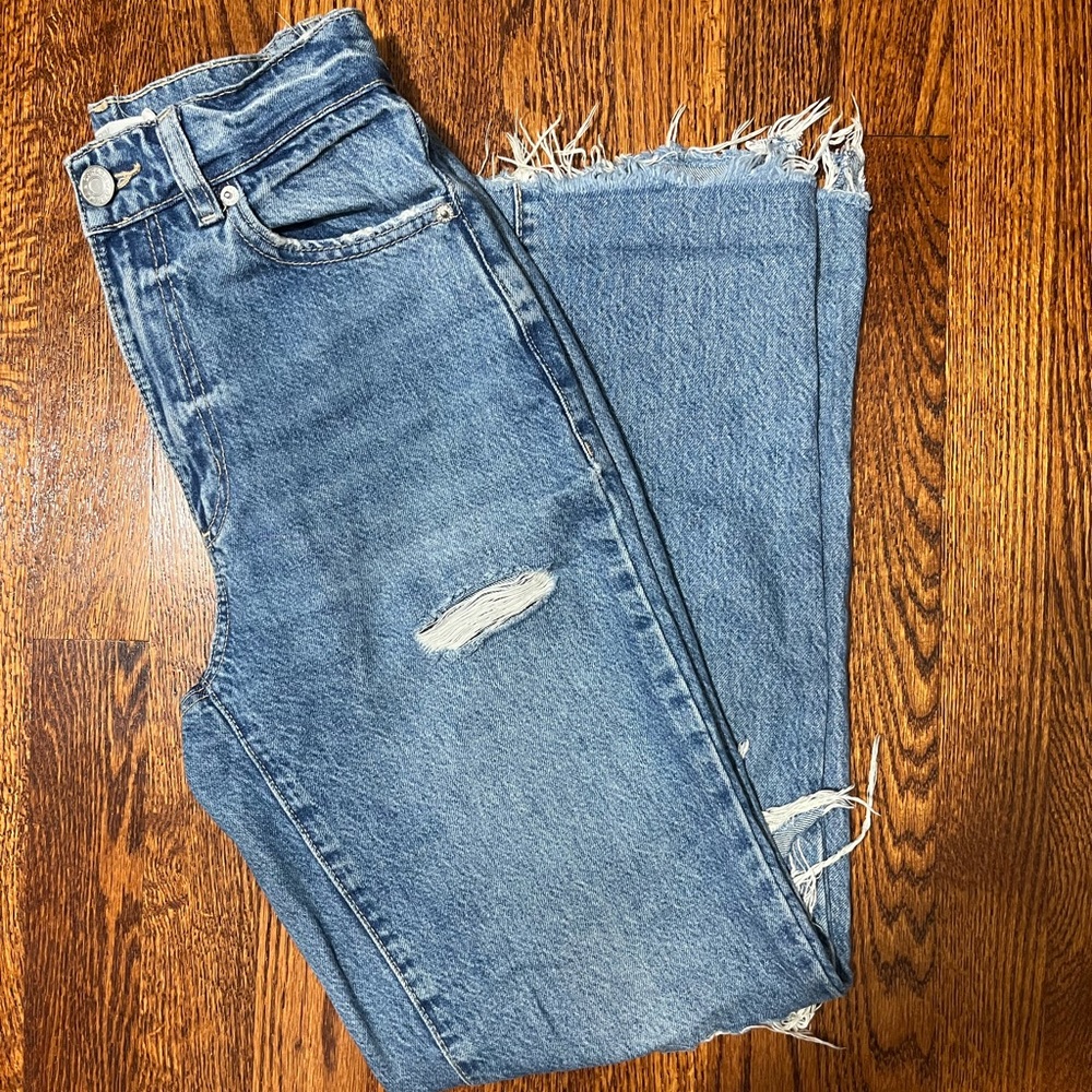 garage denim jeans with cut out knees. high rise with a straight fit.